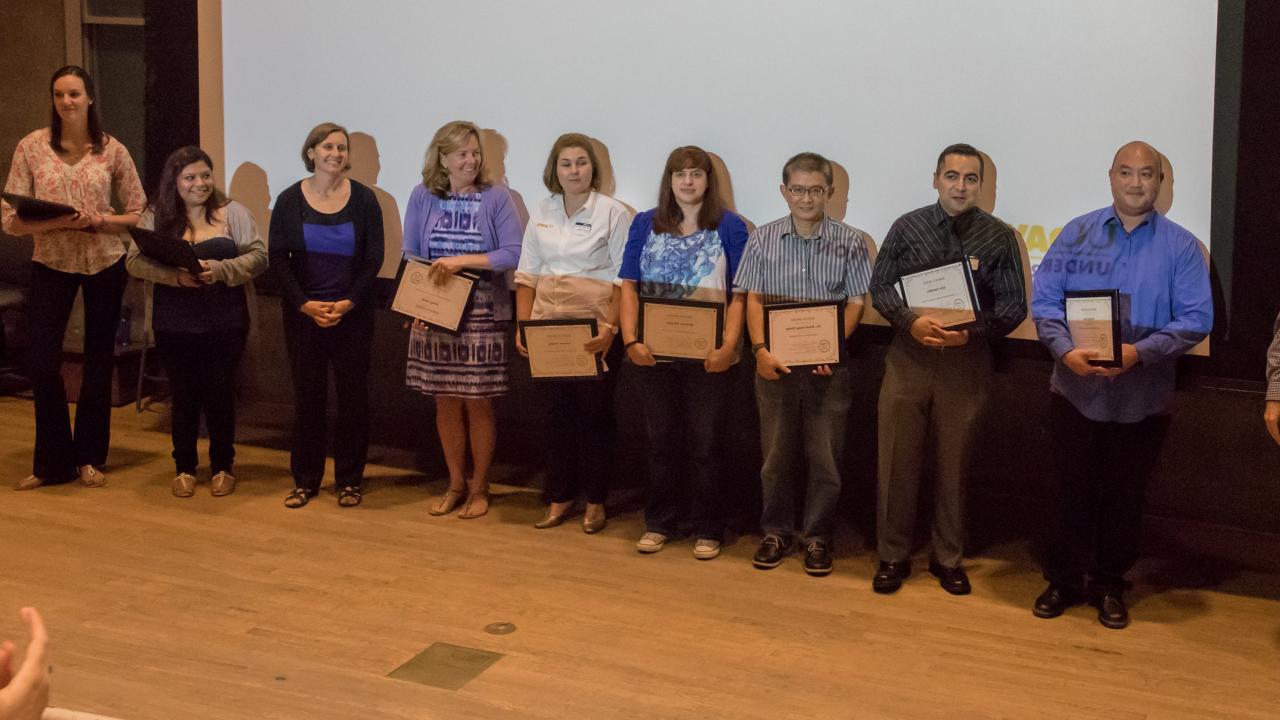 2015 recipients pictured holding awards.